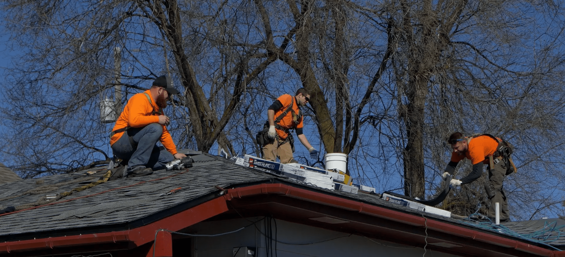 Roofers fixing roof